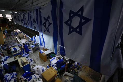 As Israel turns 75, its flag unfurls into deep divisions